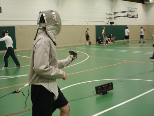 An MSU fencer stands in the en garde position as they wait for their opponent